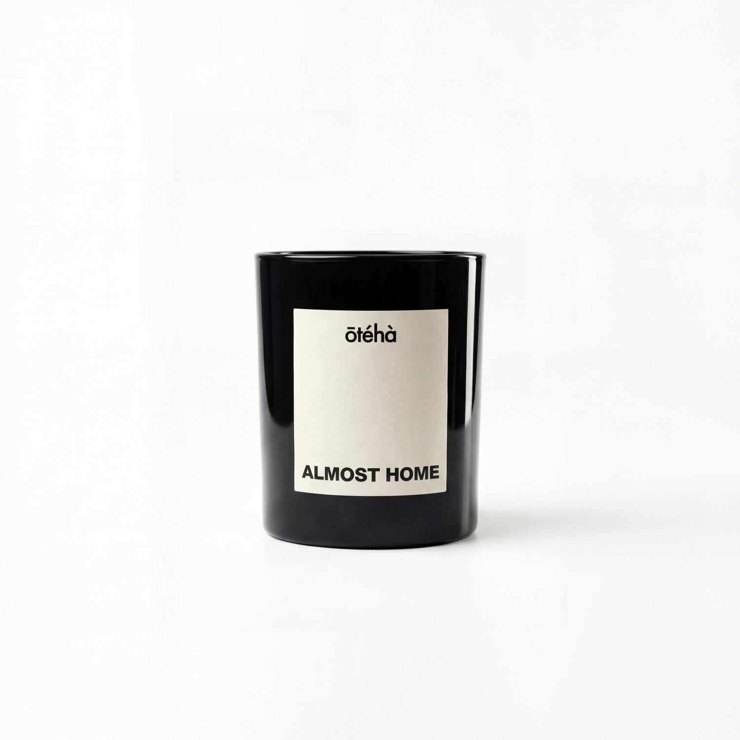 Almost Home quiet luxury scented candle by ōtéhà in minimalist black glass vessel