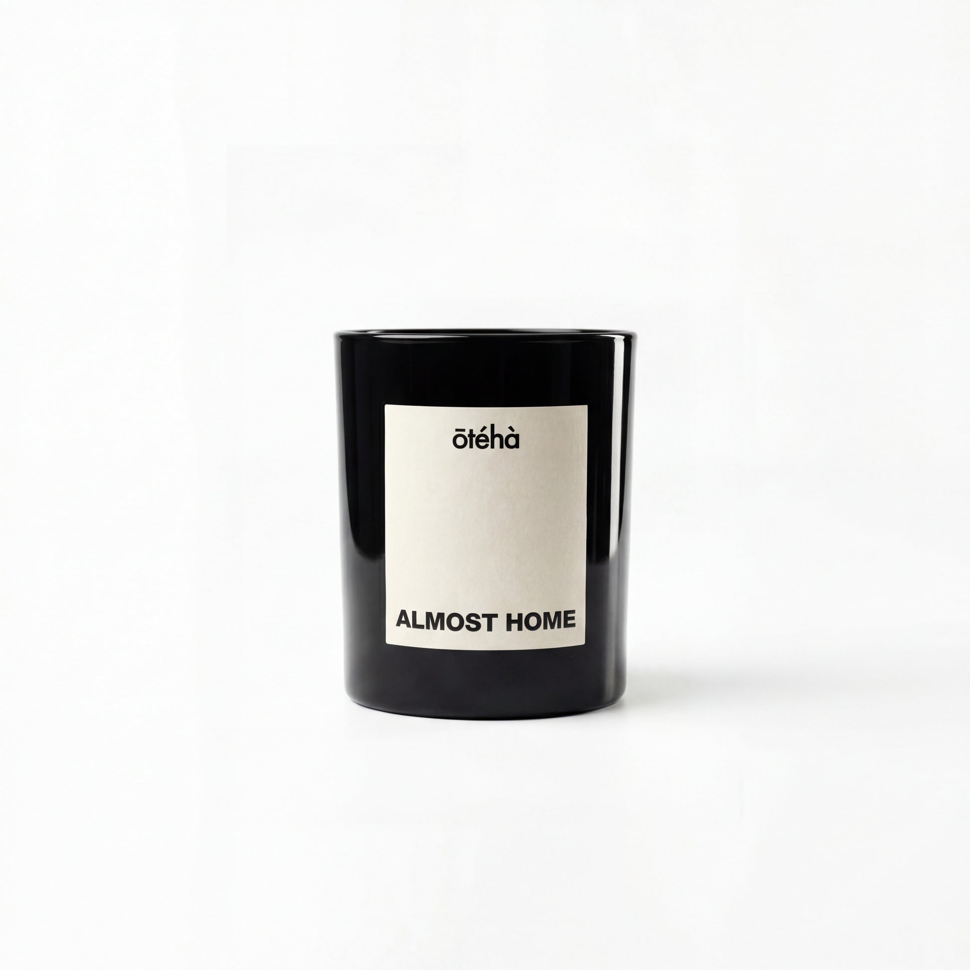 Almost Home quiet luxury scented candle by ōtéhà in minimalist black glass vessel