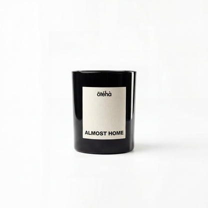 Almost Home quiet luxury scented candle by ōtéhà in minimalist black glass vessel