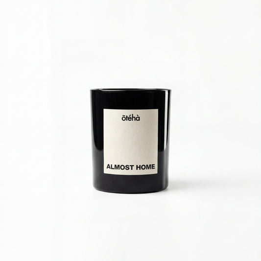Almost Home quiet luxury scented candle by ōtéhà in minimalist black glass vessel