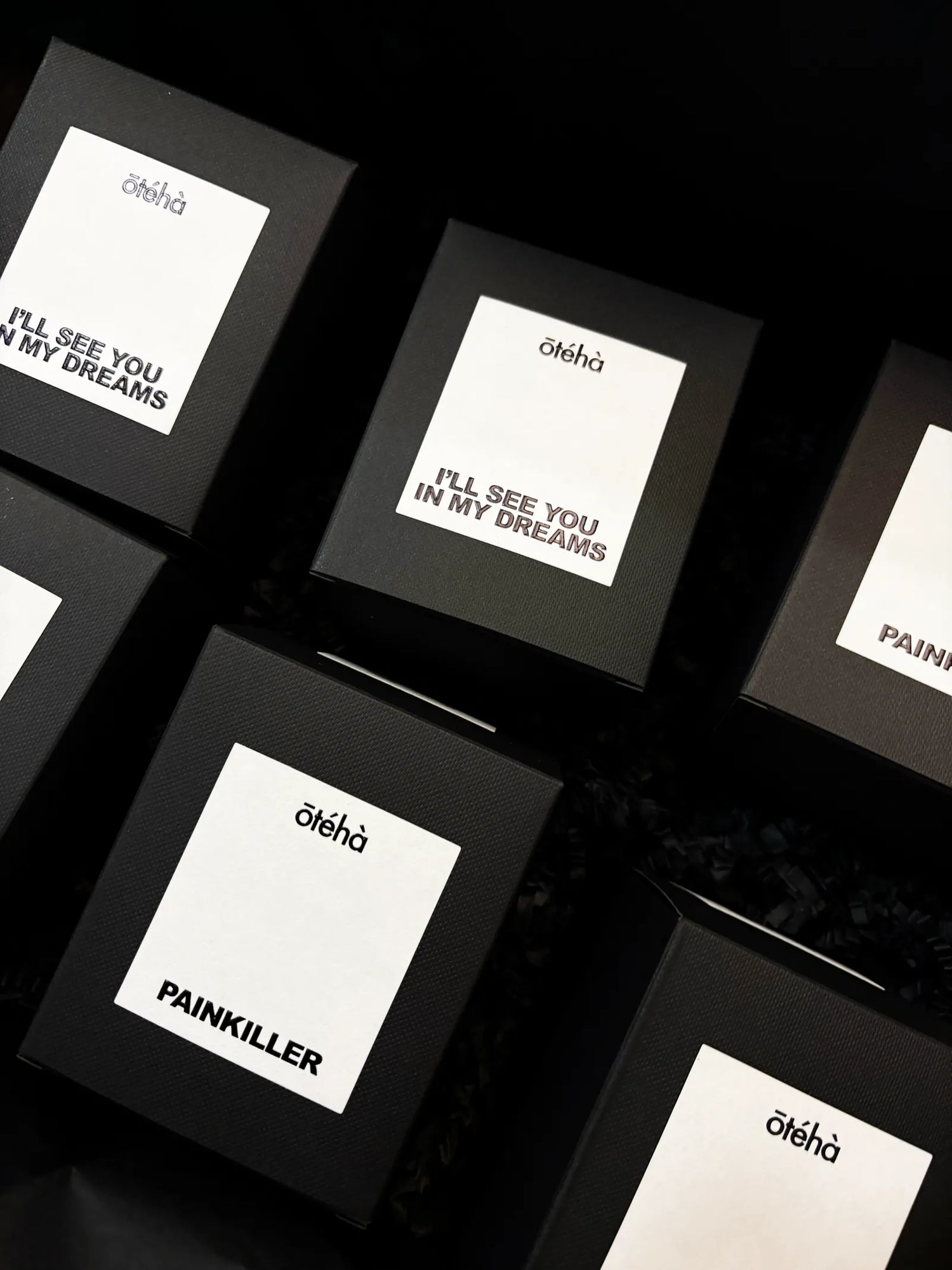 Ōtéhà luxury scented candles in black packaging with minimalist labels